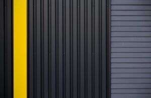 Comparison table showing DIY and professional garage door dent repair methods, pros and cons, typical costs and effectiveness.