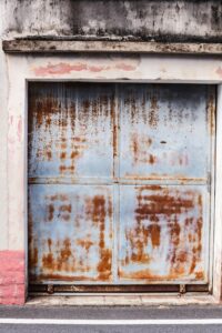 Rusty garage door damaged by Gold Coast salt air